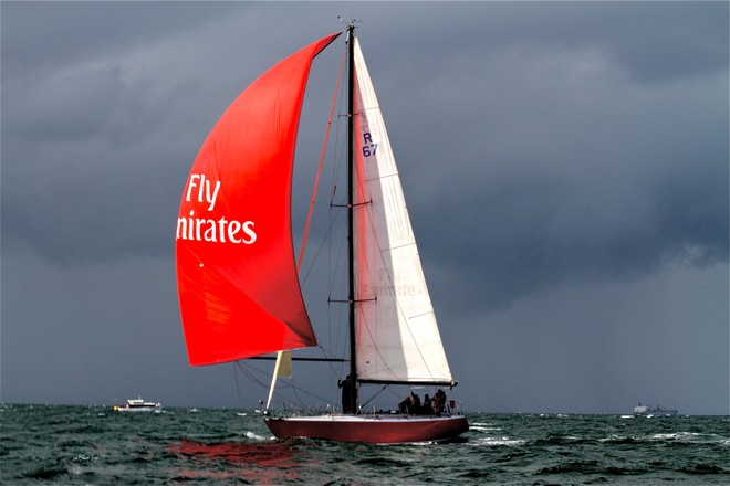 John Duffin’s Eneseay stands out ahead of an approaching squall. She won Sunday’s Division E race and the overall Division E trophy. © Bernie Kaaks
